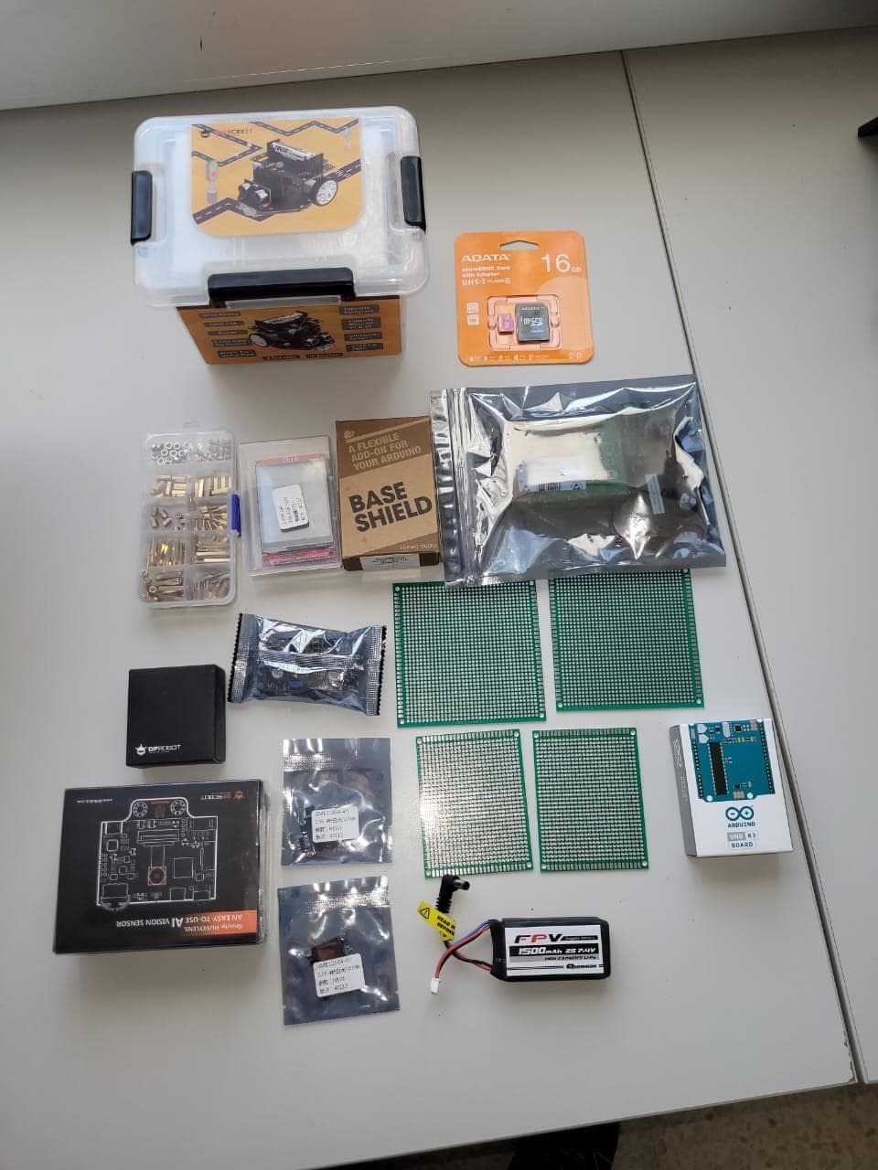 Electronic components and small circuit boards arranged on a table.