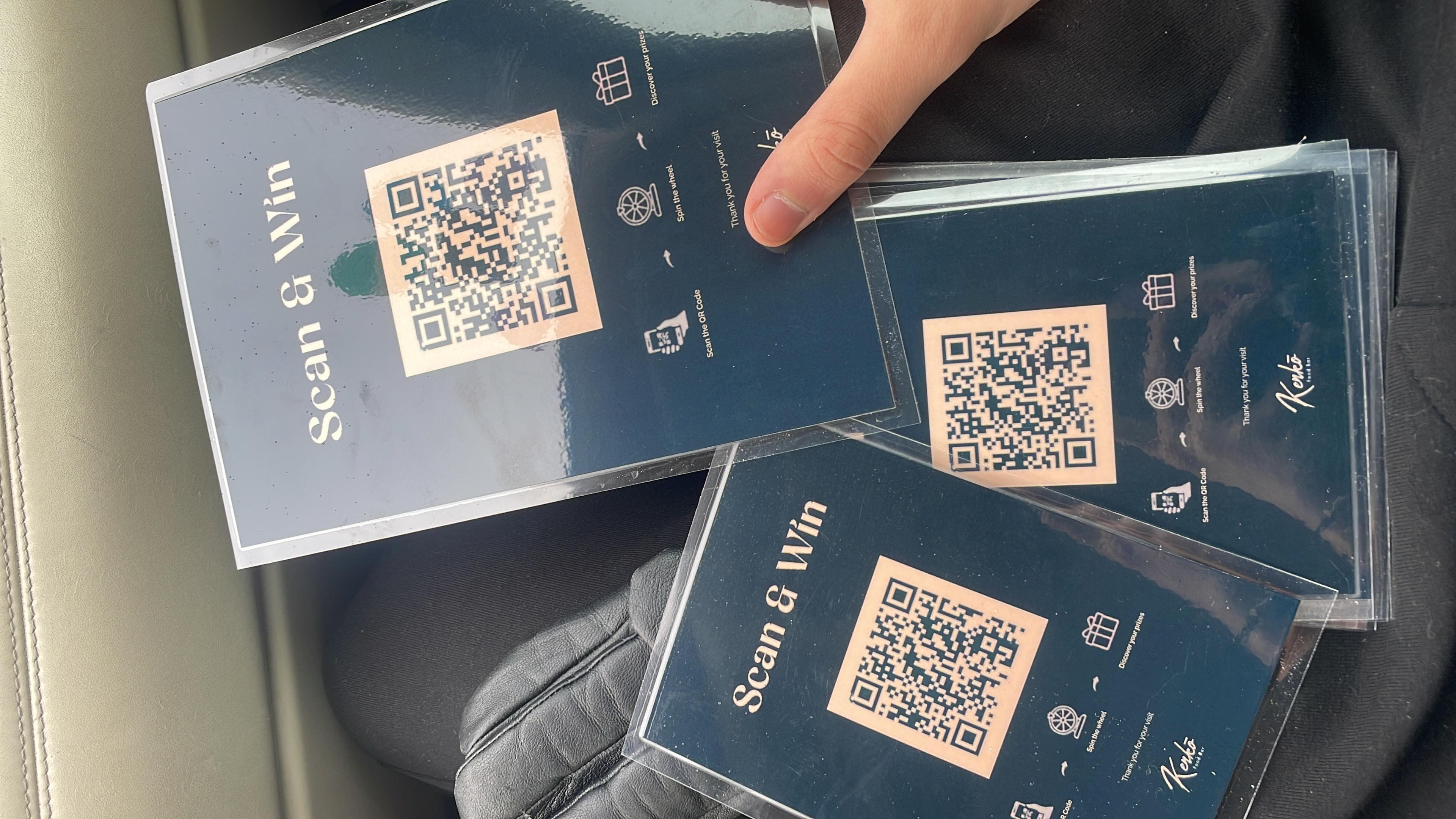 Printed cards with QR codes laid out together.