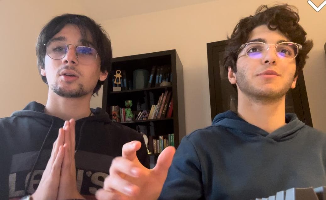 Two people appearing together in a video frame.