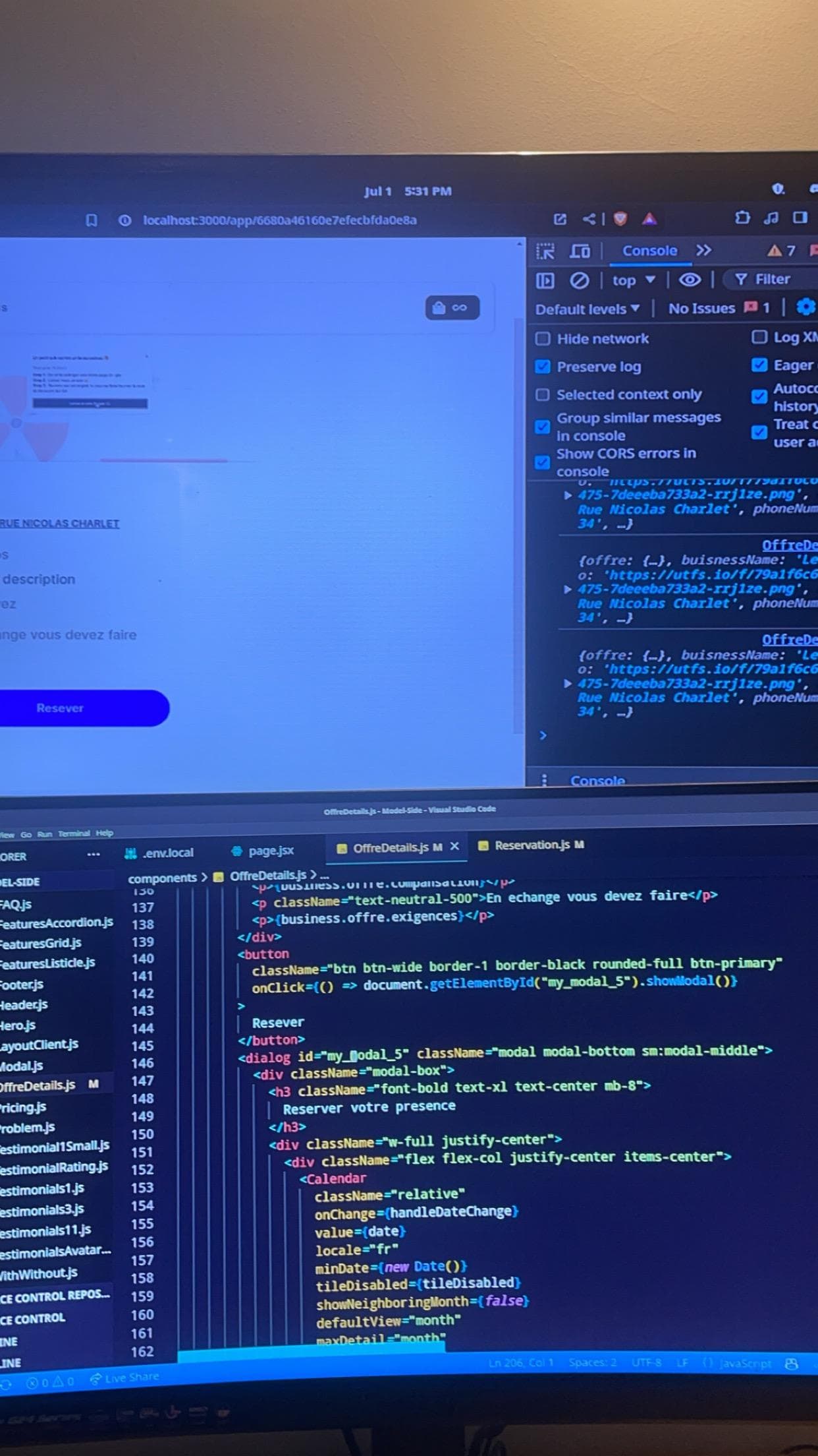 A screen displaying source code beside a browser window.