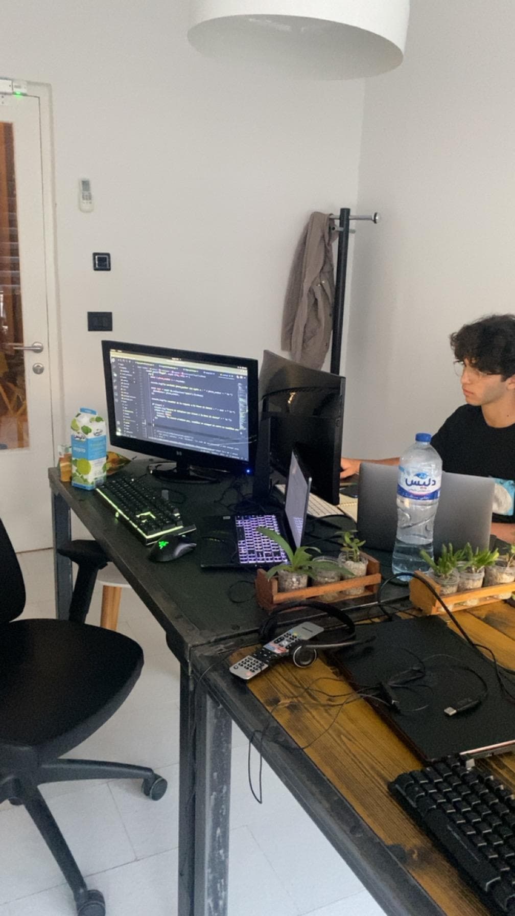 A shared workspace with computers and monitors.